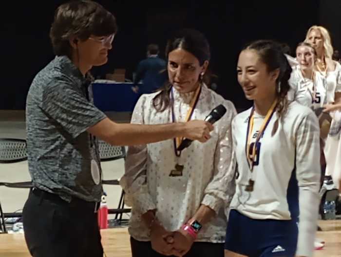 St. Thomas More coach Jes Burke (left) and junior Rhyan Miciotto - named the MVP - are interviewed following the Lady Cougars' win against Teurlings Catholic for the Division II volleyball championship on Nov. 11, 2023.